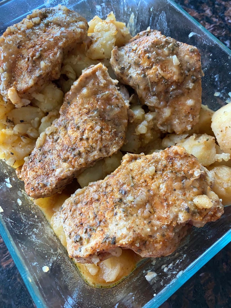 perfectly cooked Instant Pot Pork Chops And Potatoes in a serving dish