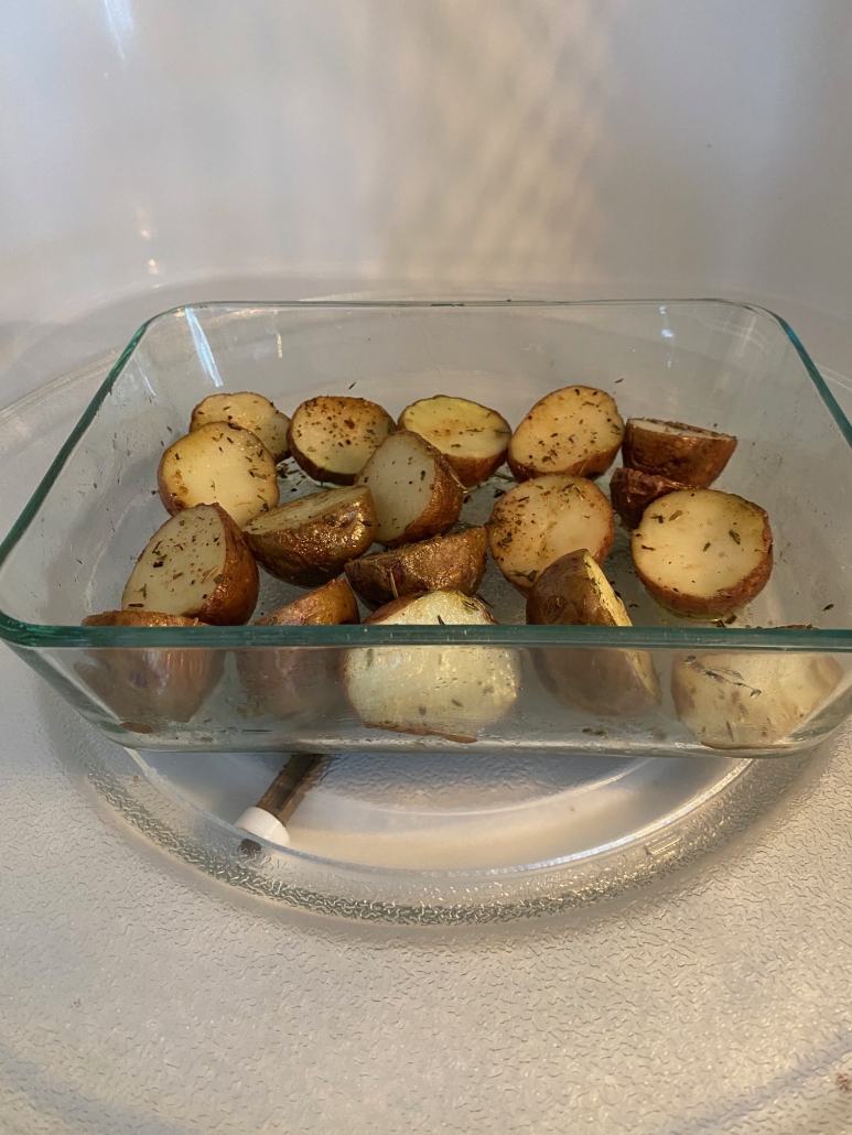 red potatoes cooking in microwave