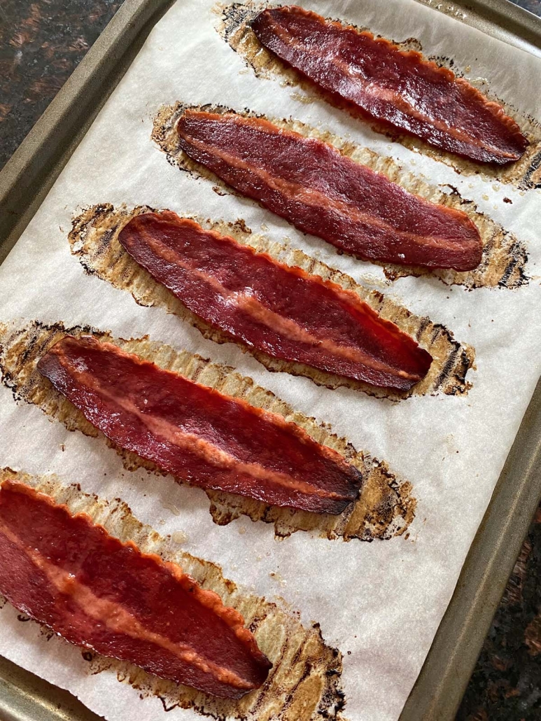 turkey bacon slices on a baking sheet