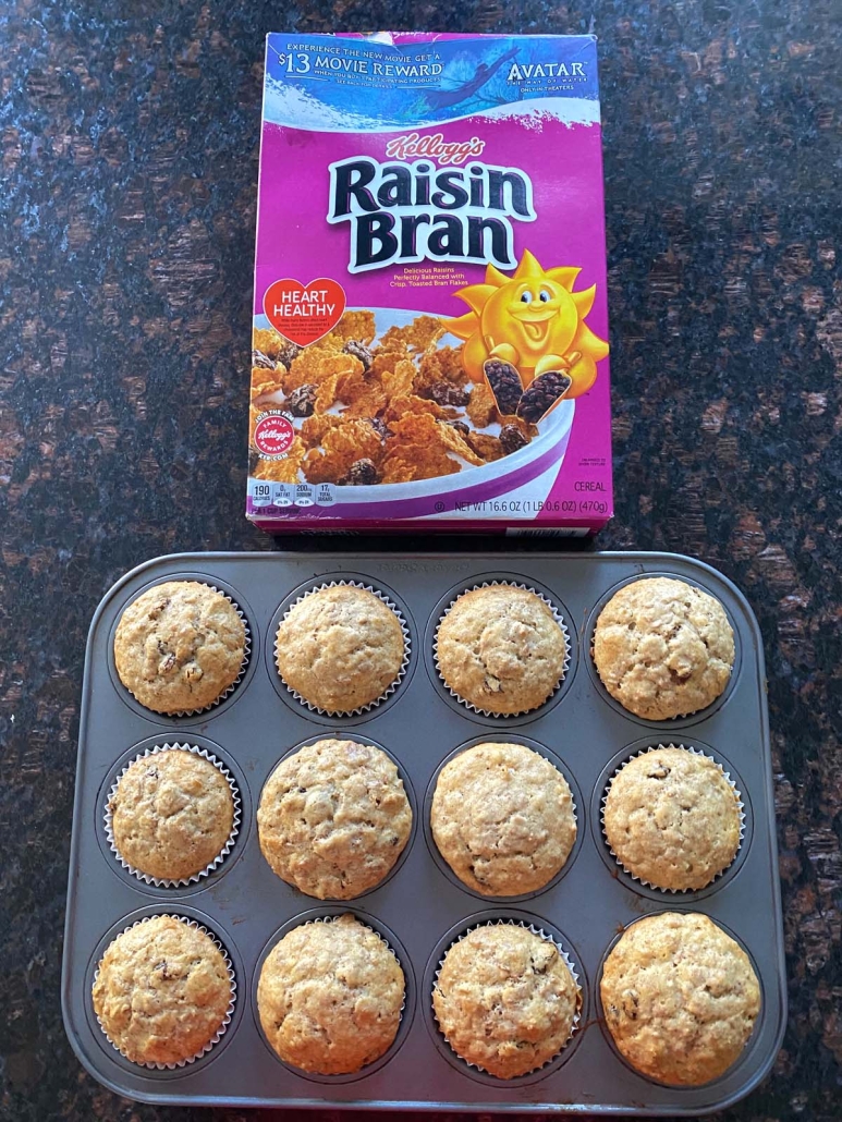 tray of Raisin Bran Muffins in front of cereal box