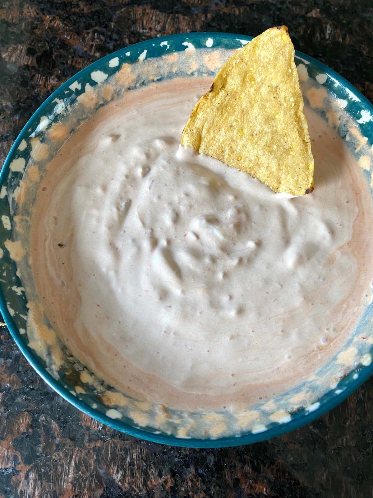 Bowl of sour cream and salsa dip.