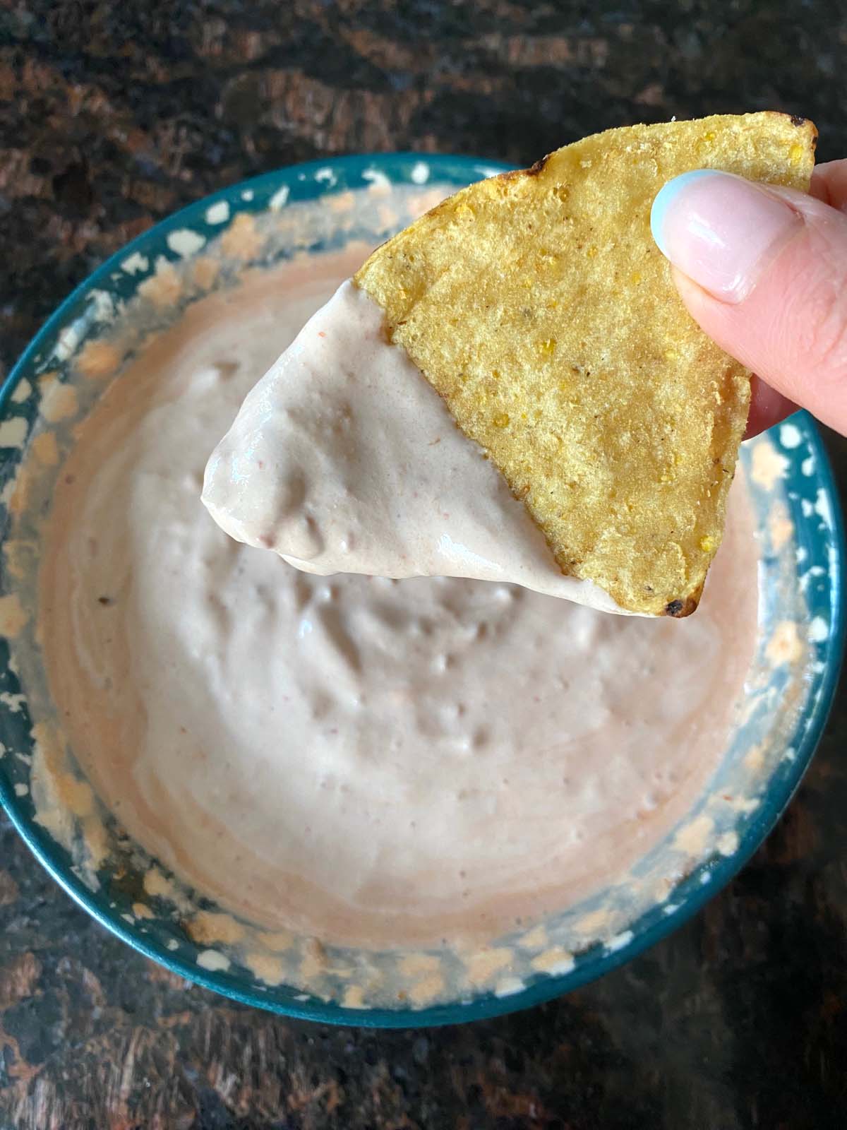 Bowl of sour cream and salsa dip.