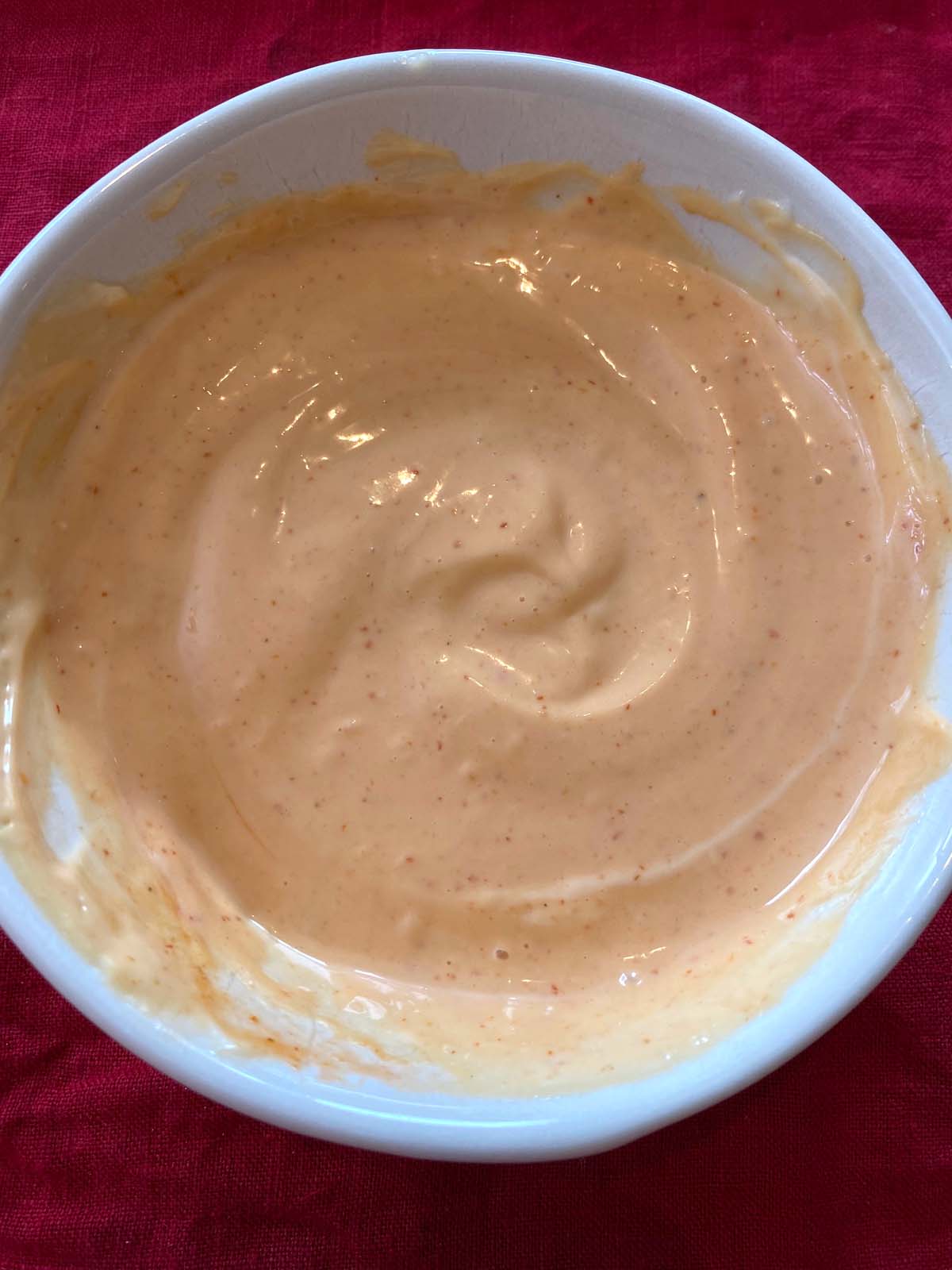 Sriracha spicy mayo in a white bowl.