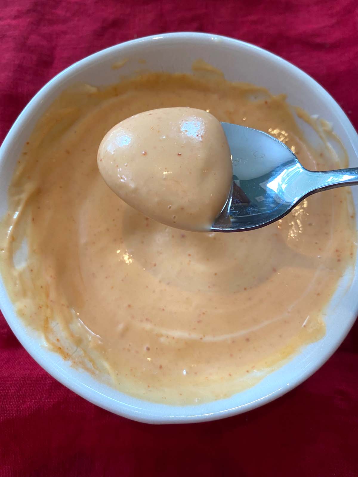 Sriracha spicy mayo in a white bowl.