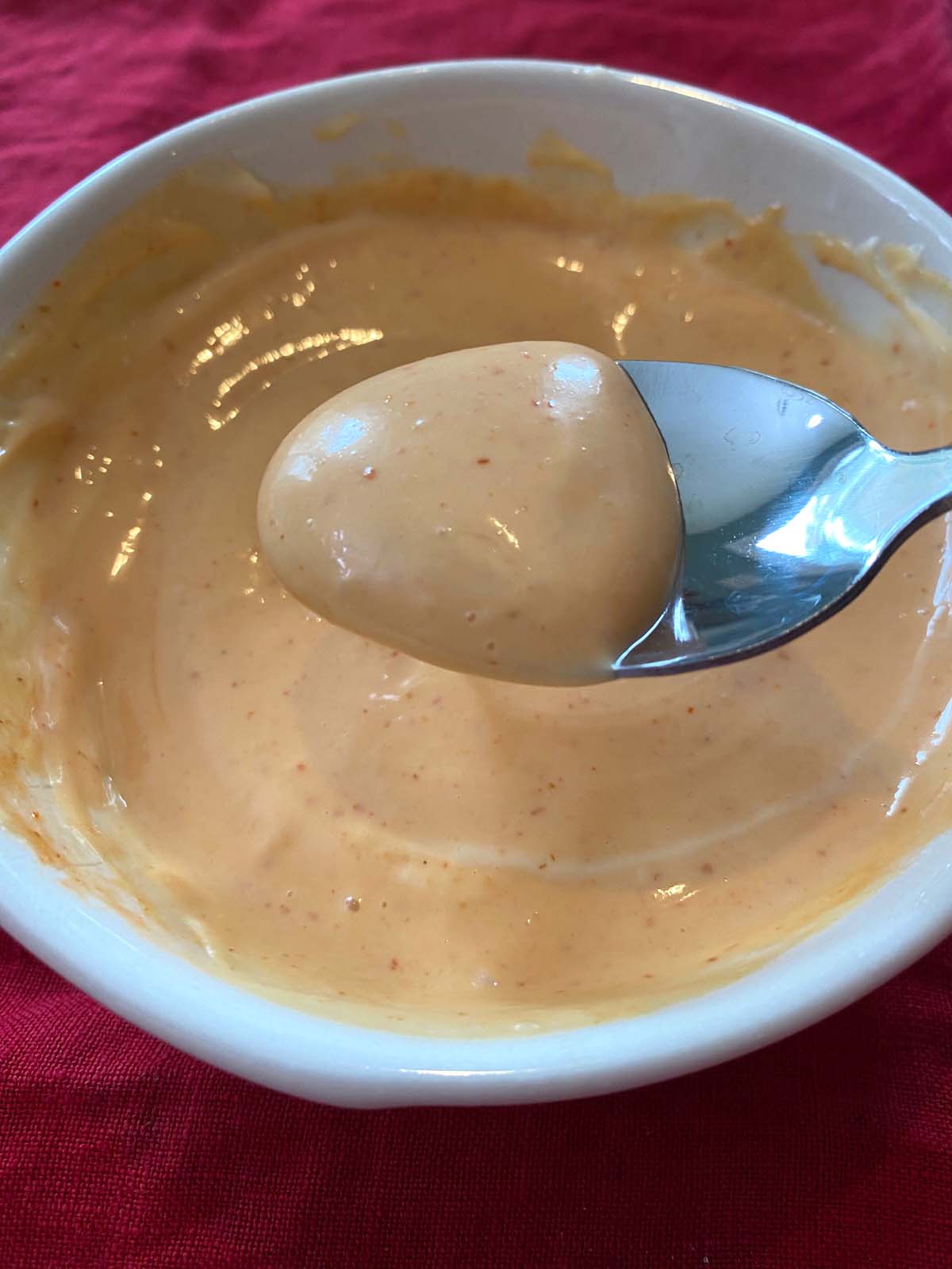 Sriracha spicy mayo in a white bowl.