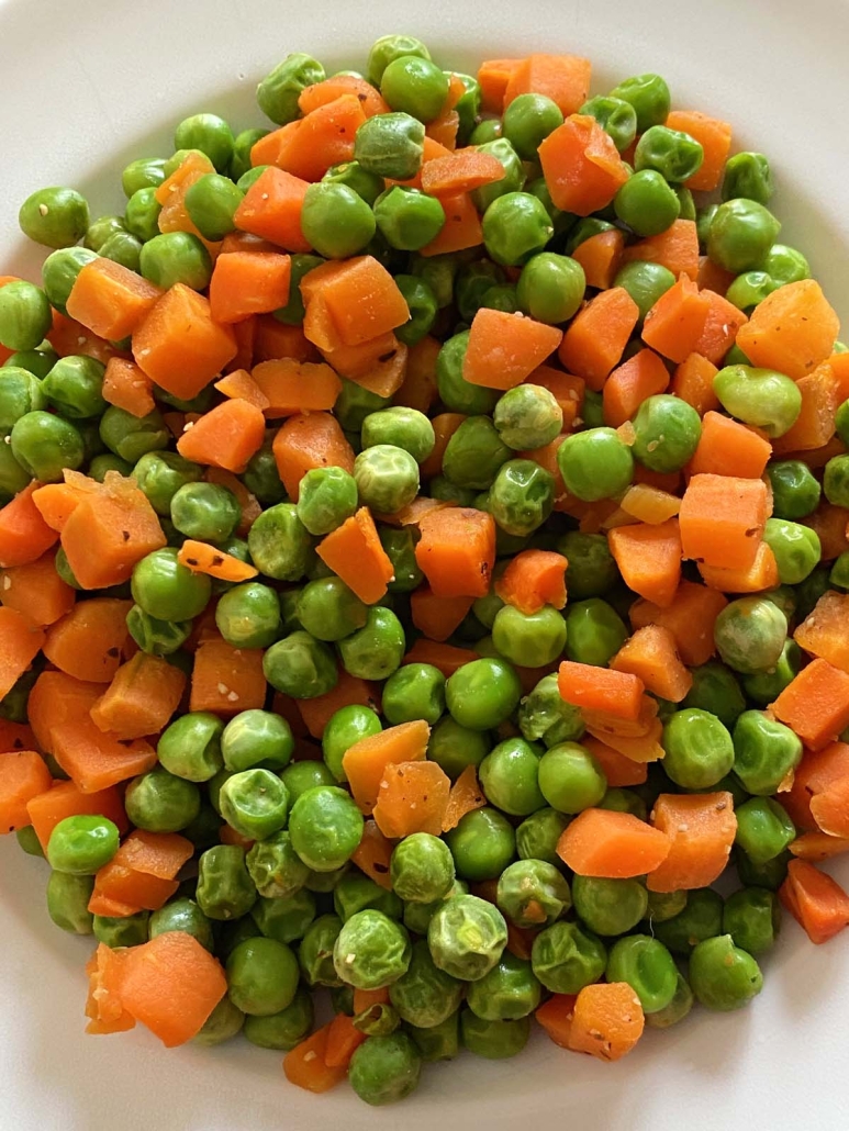 seasoned peas and carrots on a plate