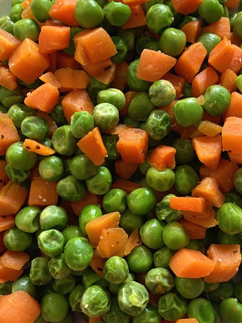 close-up of cooked peas and carrots