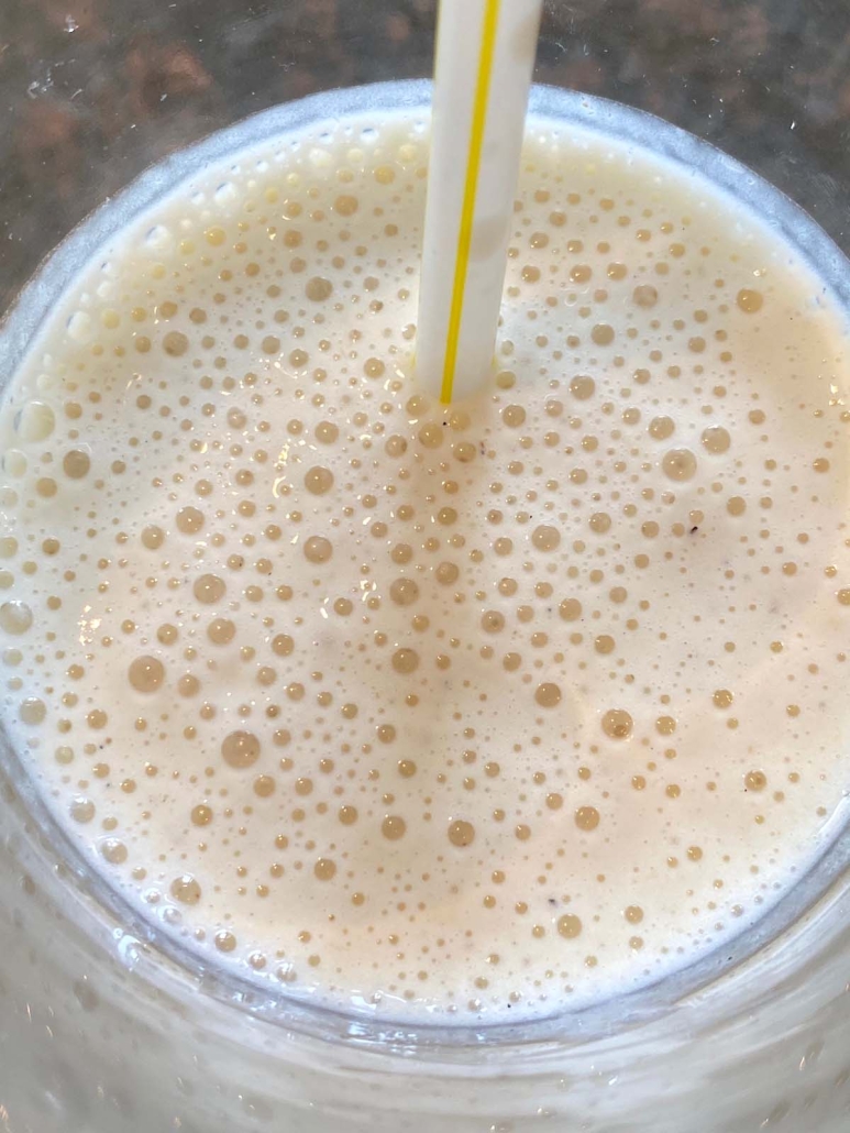 foamy Banana Milkshake with straw