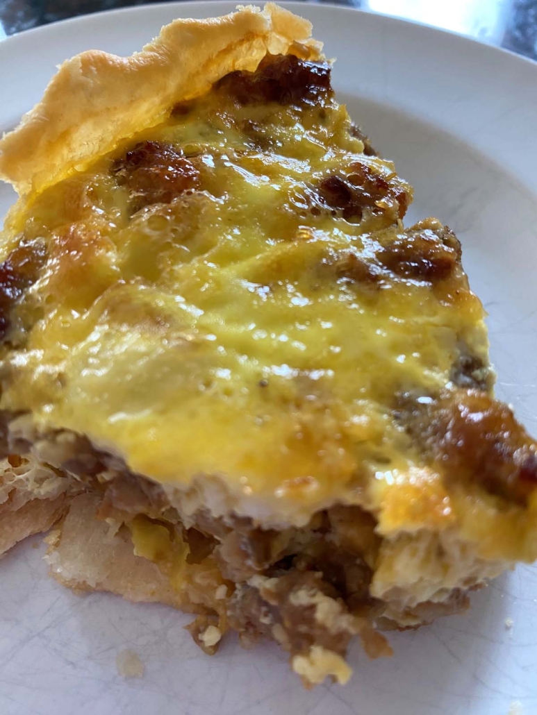 slice of brunch dish Sausage Quiche