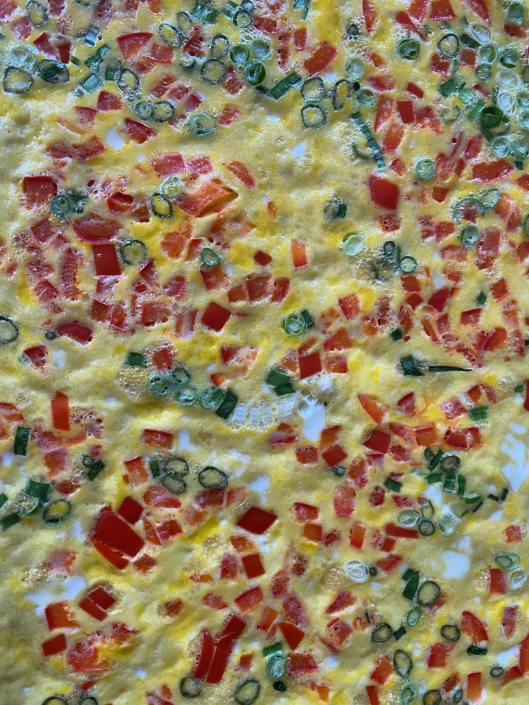 close-up of baked eggs with toppings