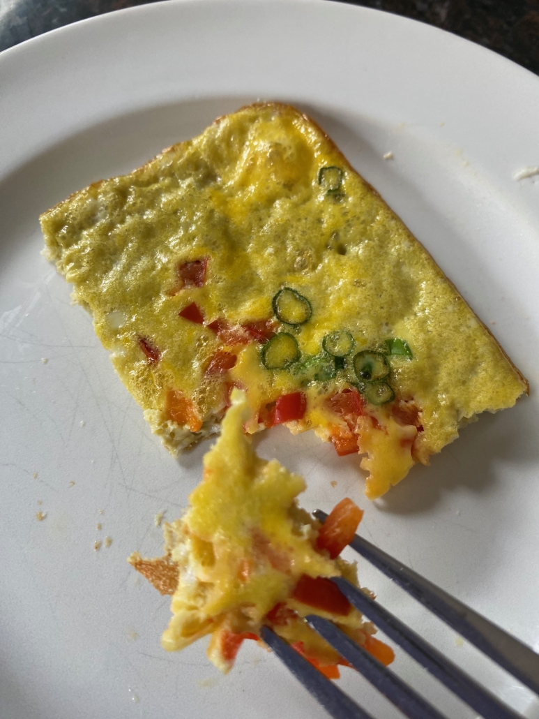 fork holding bite of Sheet Pan Eggs