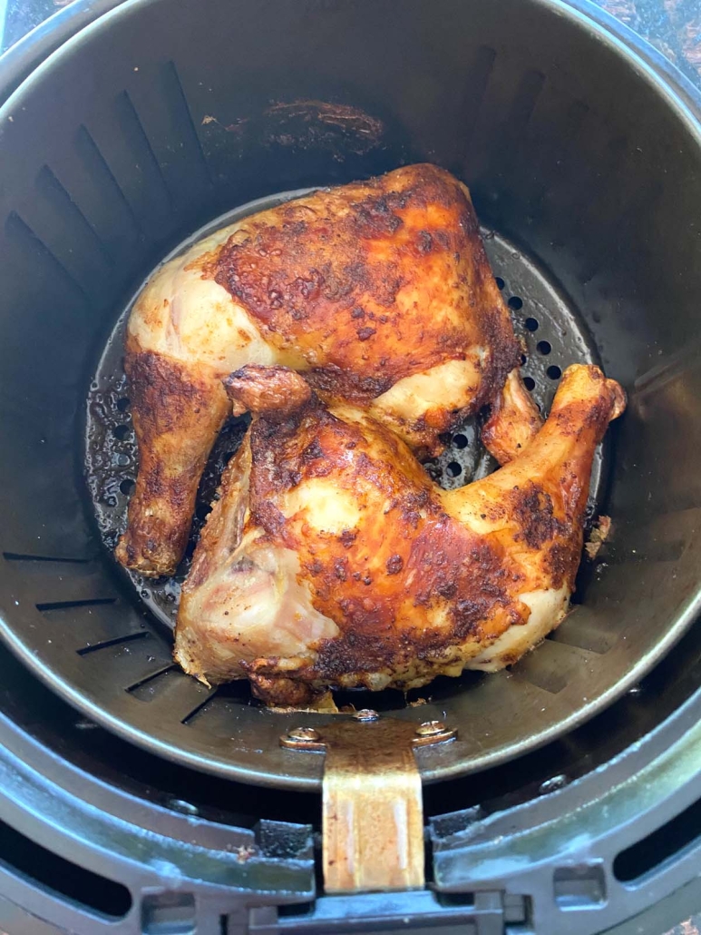 golden brown chicken leg quarters in the air fryer