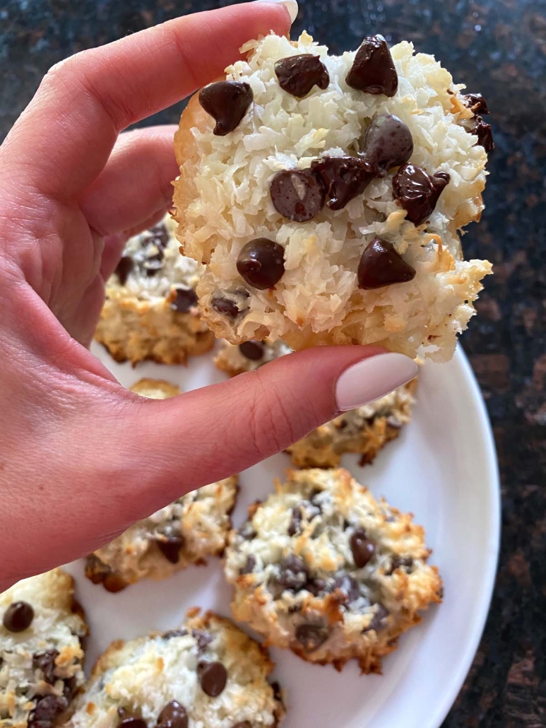 hand holding Coconut Chocolate Chip Macaroon