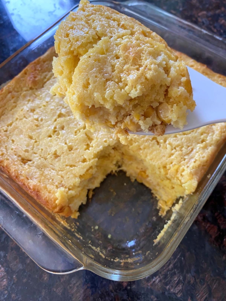 Cornbread Casserole with a slice cut out