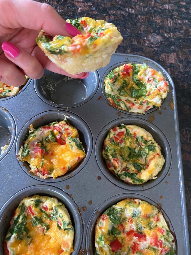 hand holding Egg White Bite, baked in the oven