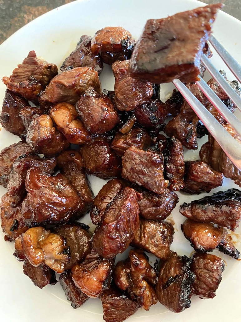 fork holding piece of Hibachi Steak