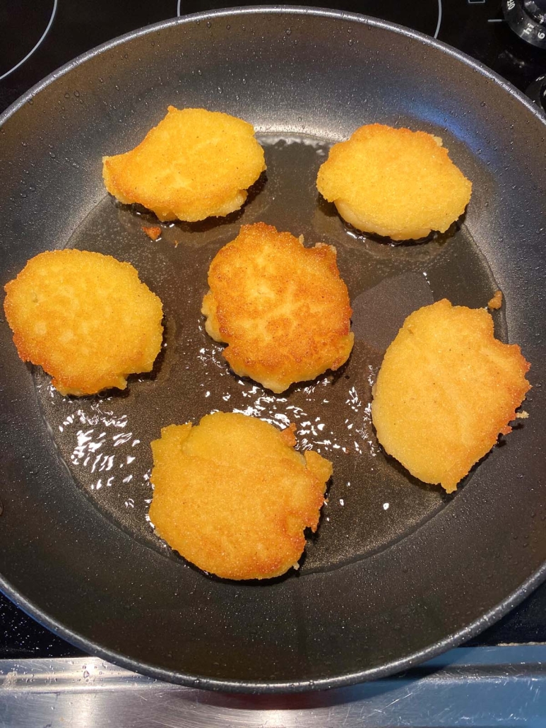 Hot Water Cornbread sizzling in a skillet