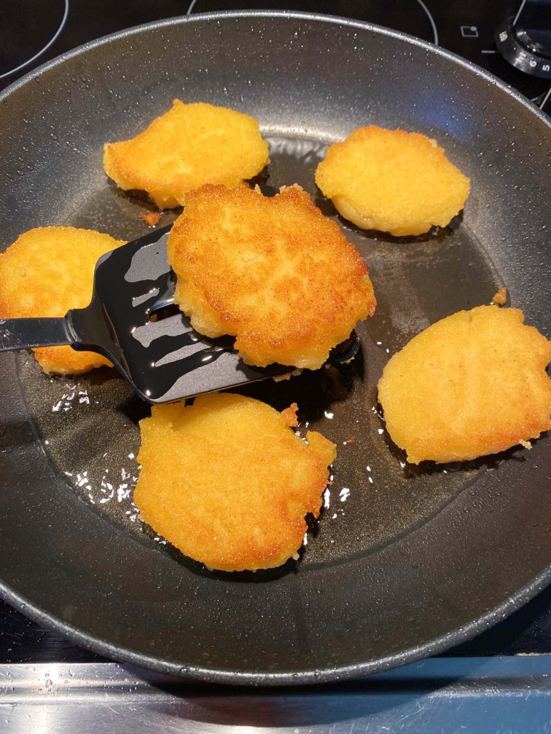 Hot Water Cornbread cooking in oil 