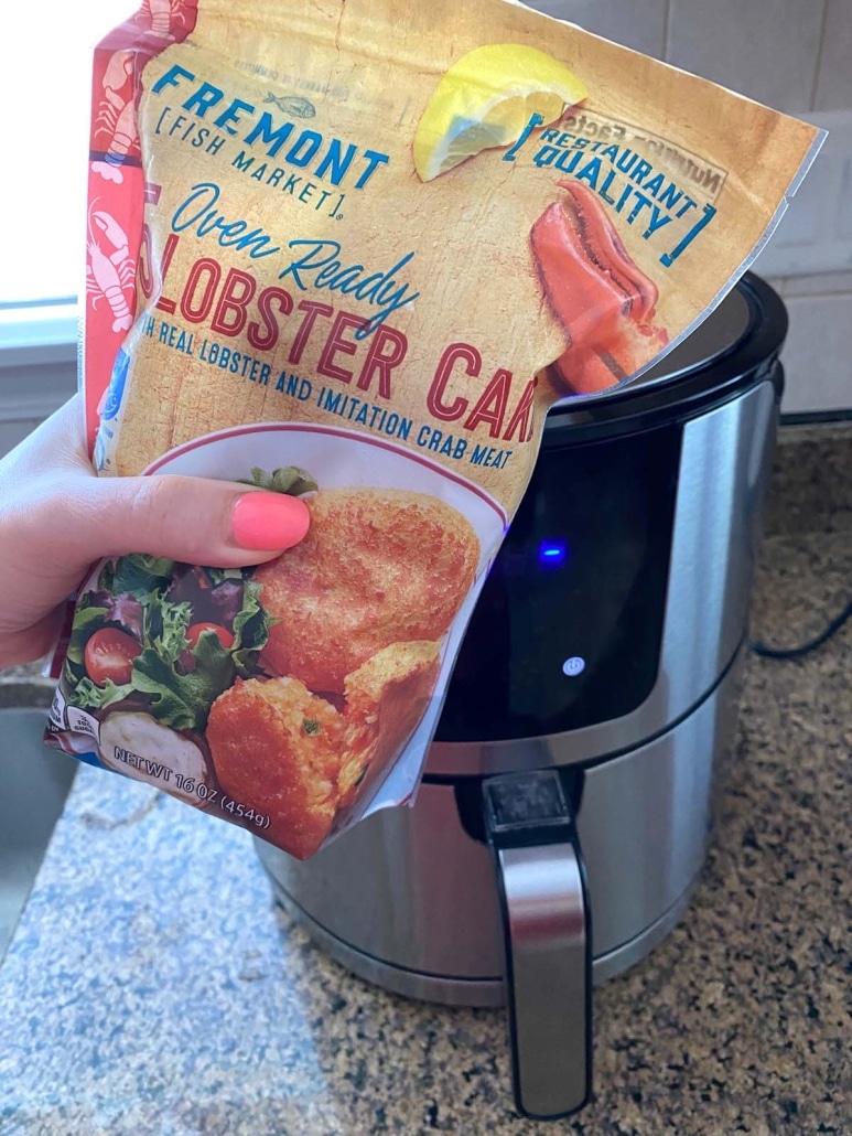 package of lobster cakes in front of air fryer