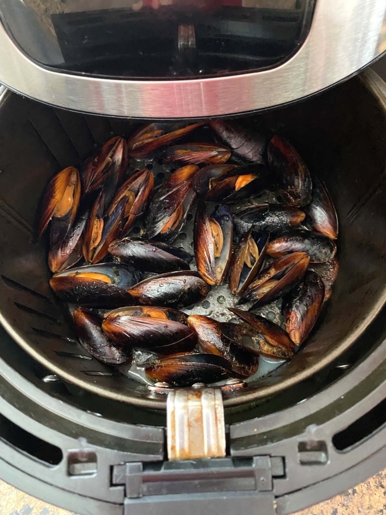 air fryer opened to show easy appetizer frozen mussels