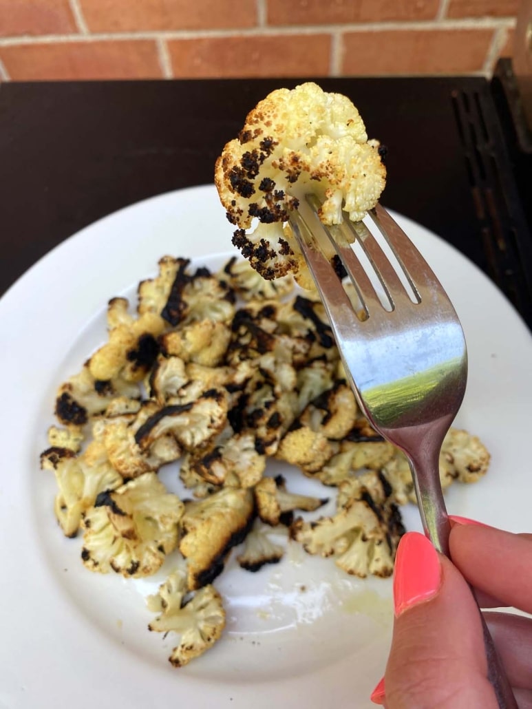 fork holding Grilled Cauliflower Florets cooked in foil