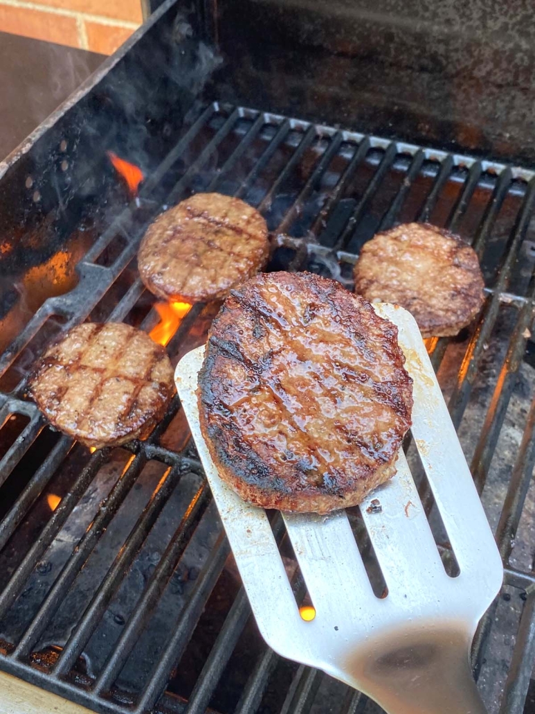 spatula holding grilled burger