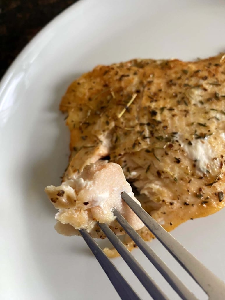 fork holding bite of Air Fryer Rainbow Trout