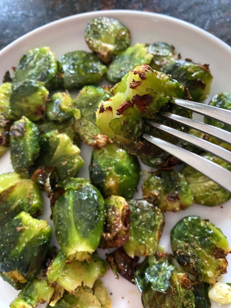 fork holding Smashed Brussels Sprouts In The Air Fryer
