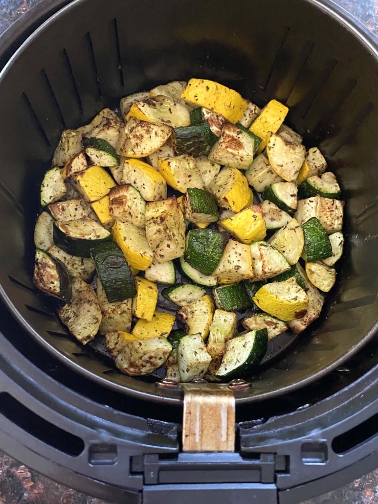 chopped zucchini and squash in air fryer basket