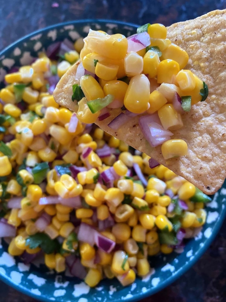 copycat Chipotle corn salsa on a tortilla chip