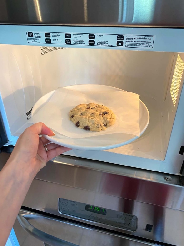 placing Chocolate Chip Cookie in microwave