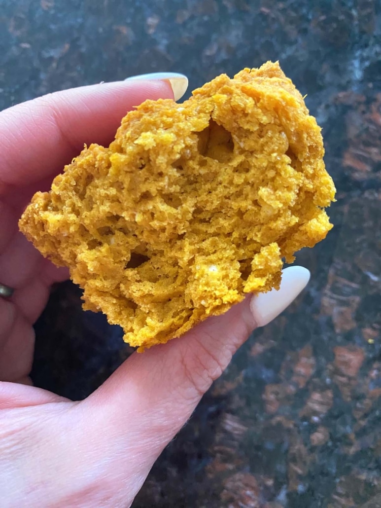 hand holding 2-Ingredient Pumpkin Muffin With Cake Mix