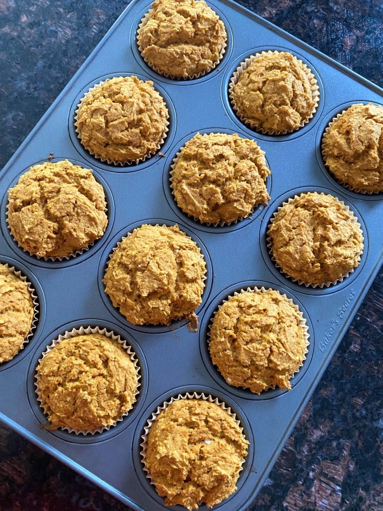 baking tray of golden brown pumpkin muffins