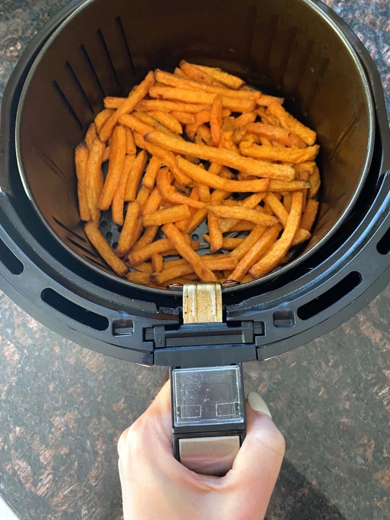 air fryer basket containing Trader Joe’s Sweet Potato Fries