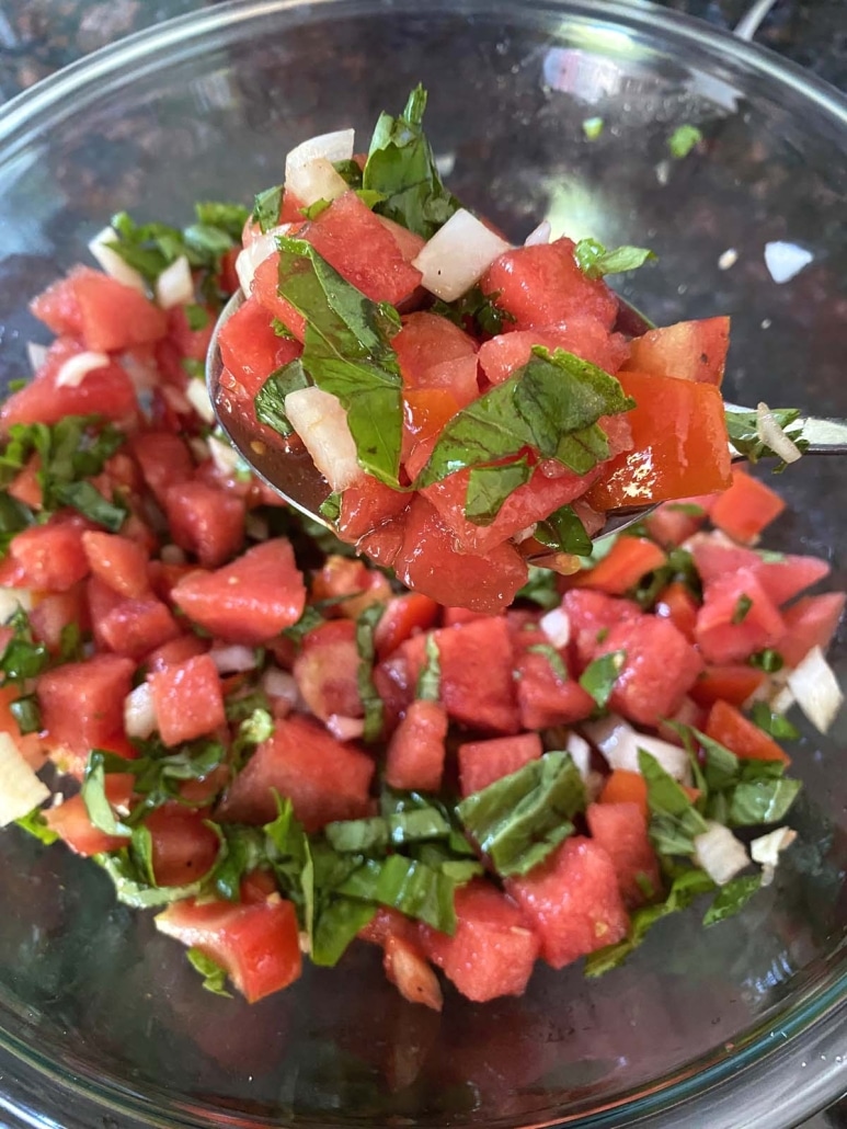 toss together Watermelon Tomato Salad and dressing