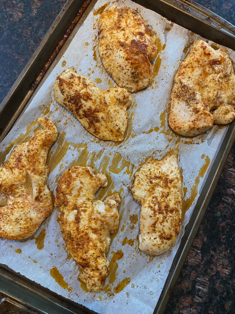 Baked Thin Sliced Chicken Breasts on a baking sheet