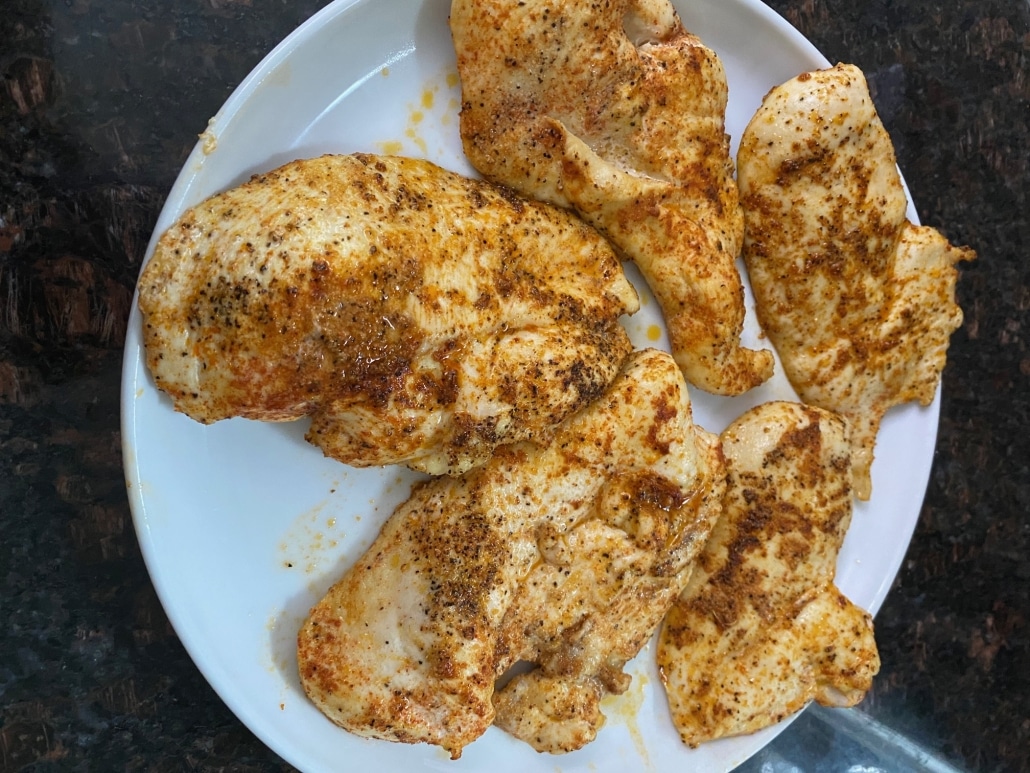 Baked Thin Sliced Chicken Breasts topped with seasonings