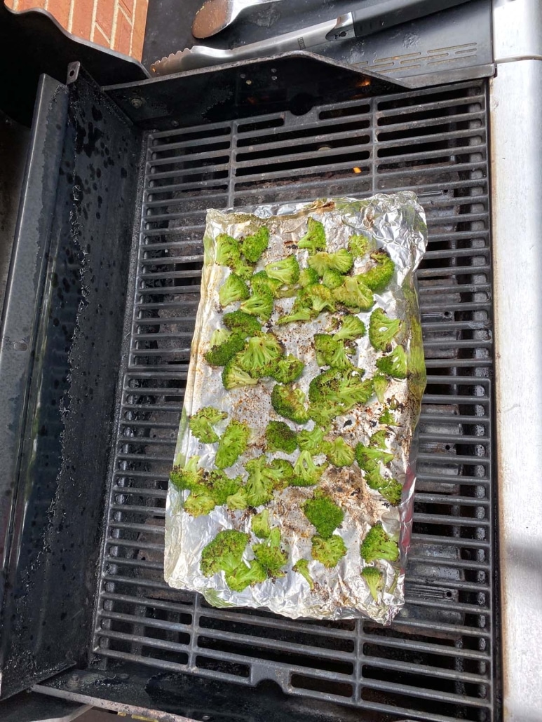 broccoli florets cooking on the grill
