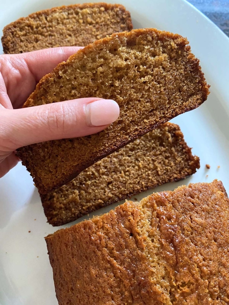 hand holding slice of Honey Cake