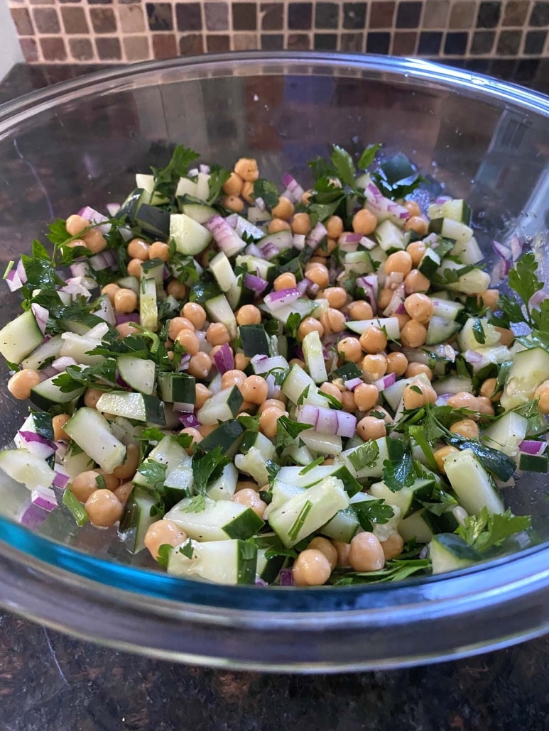 salad bowl with chopped ingredients for Cucumber Chickpea Salad