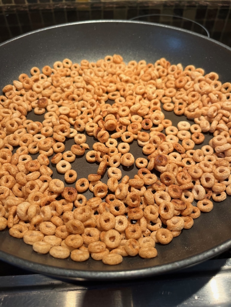 Cheerios frying in a skillet