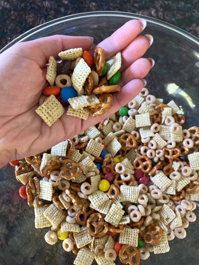 hand holding a portion of Homemade Chex Mix