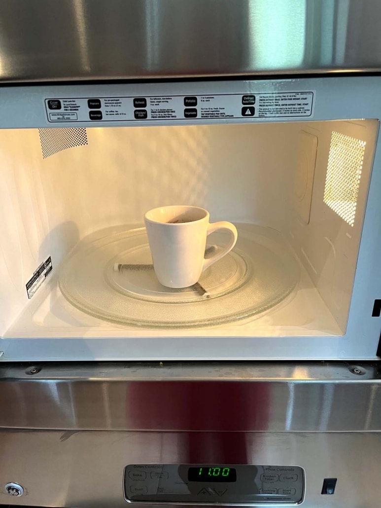 Nutella Mug Cake shown in microwave