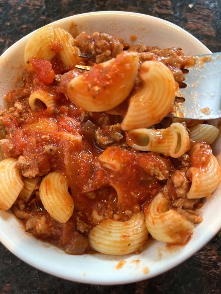 fork with bite of easy Ground Turkey Bolognese Sauce with noodles