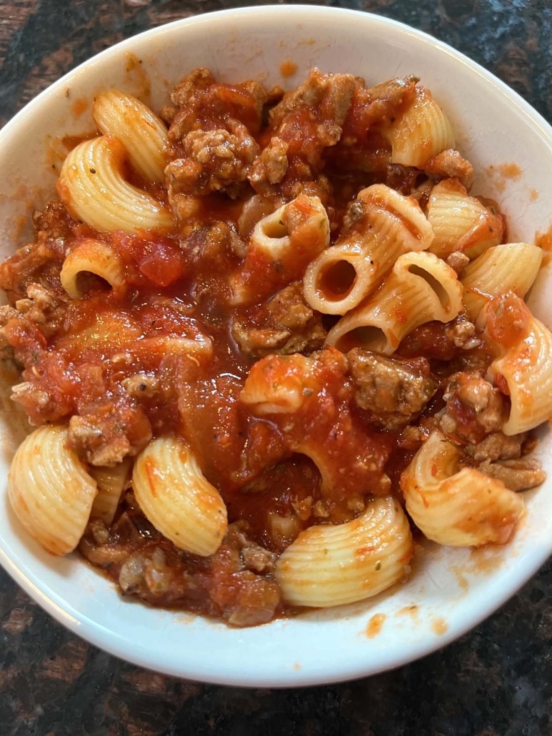 serving bowl of Ground Turkey Bolognese Sauce with noodles