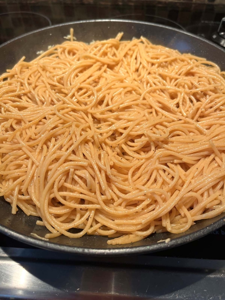 whole wheat spaghetti coated in garlic-infused olive oil