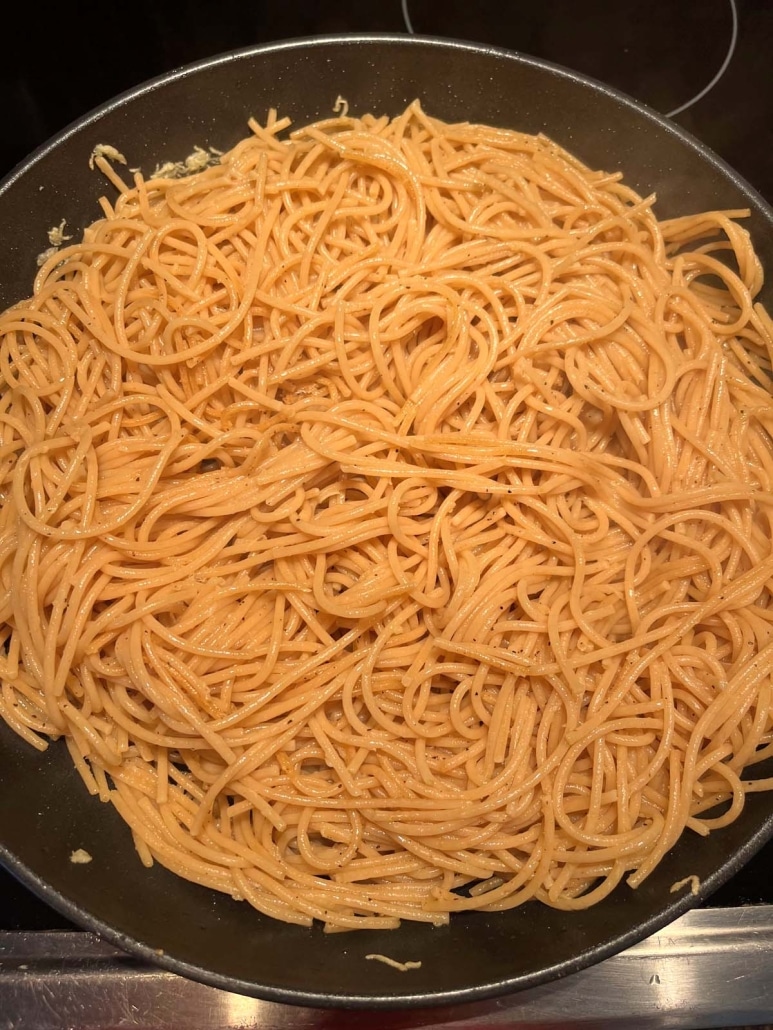 Whole Wheat Spaghetti With Garlic And Olive Oil in a skillet