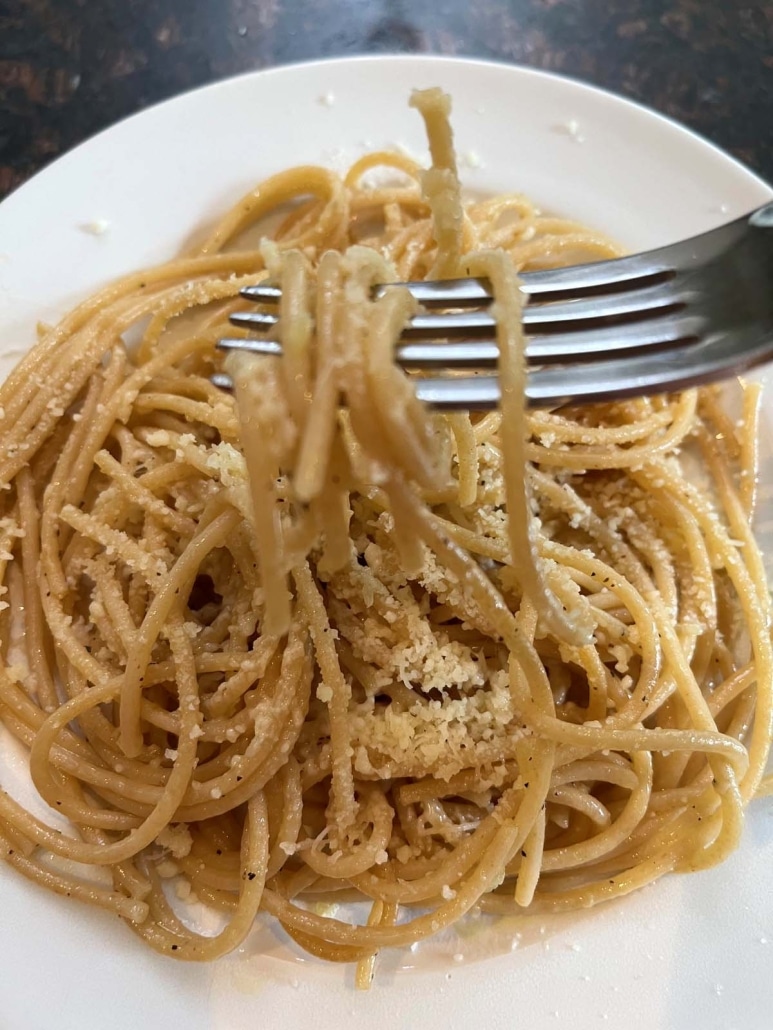 fork picking up strands of Whole Wheat Spaghetti With Garlic And Olive Oil