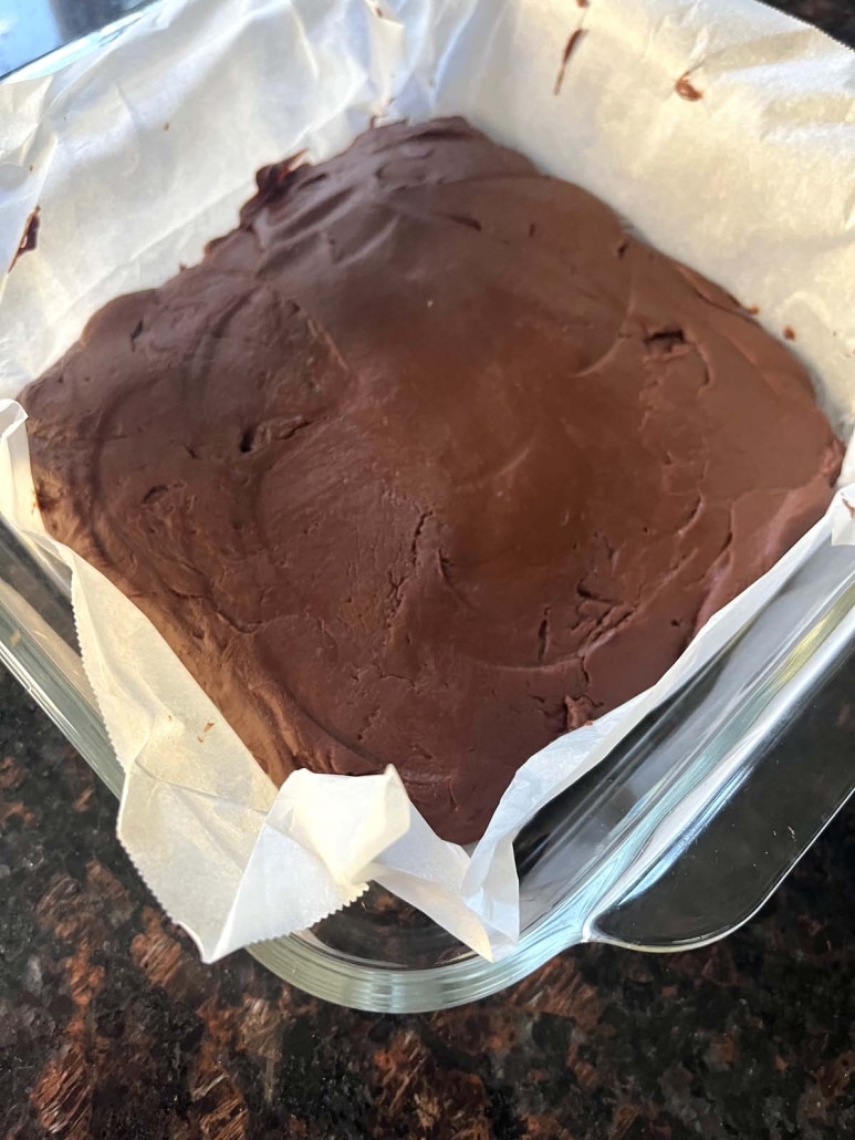 2-Ingredient Microwave Fudge in parchment paper-lined baking dish