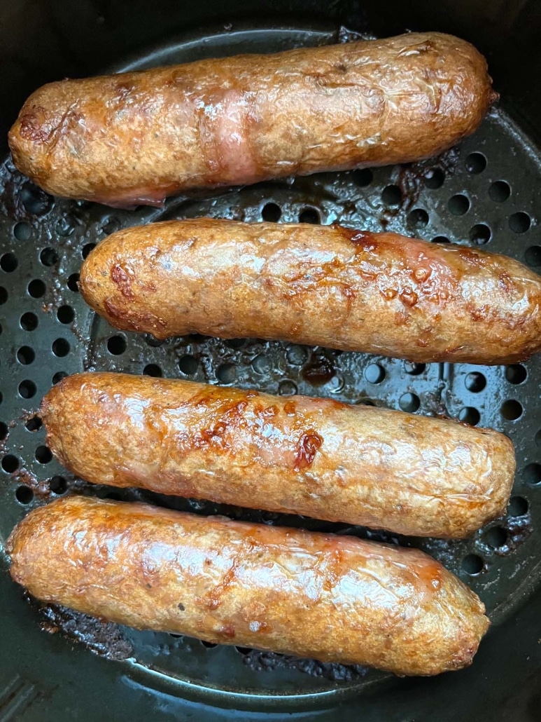 Beyond Sausages sizzling in an air fryer